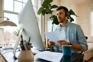 momentum-business-hub-businessman-talking-during-online-video-meeting-while-working-at-home-office